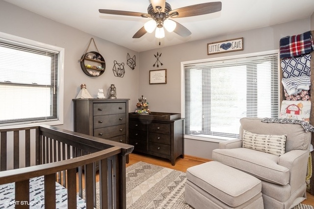 236 Kingsbridge Road Elk Grove Village, IL 60007 - Photo 9 of 13 a bedroom with furniture and window