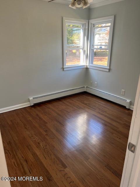 718 Pine Drive Brick, NJ 08723 - Photo 11 of 33 an empty room with wooden floor and windows