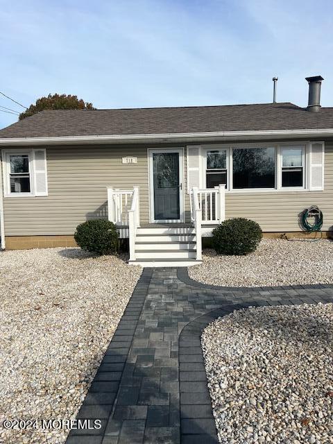 718 Pine Drive Brick, NJ 08723 - Photo 30 of 33 a front view of a house with a yard