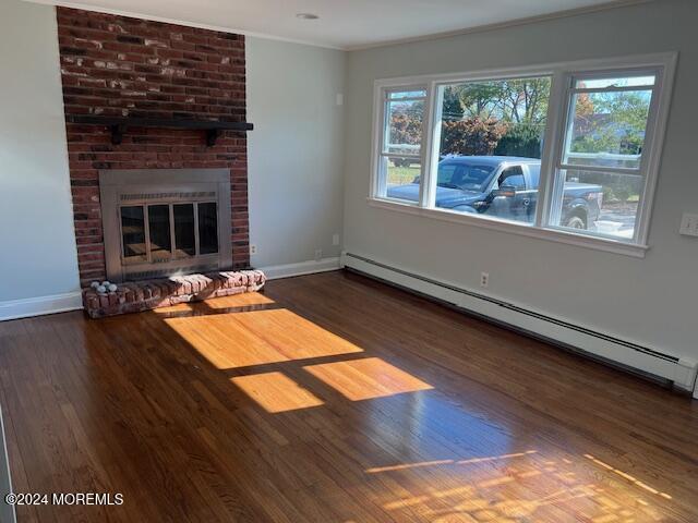 718 Pine Drive Brick, NJ 08723 - Photo 3 of 33 a living room with hard wood floors and a fireplace