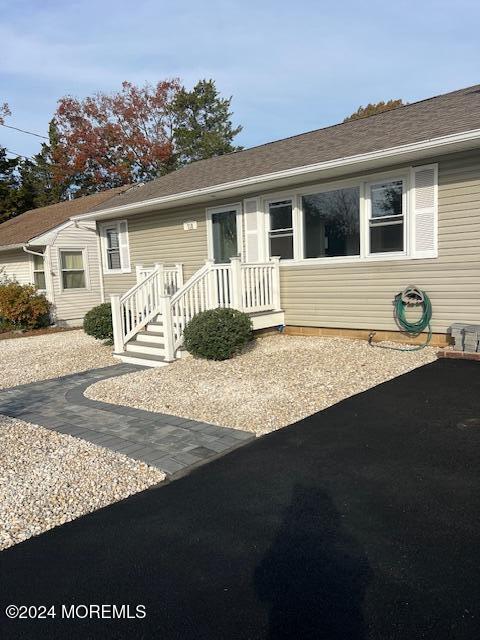718 Pine Drive Brick, NJ 08723 - Photo 32 of 33 a front view of a house with garden