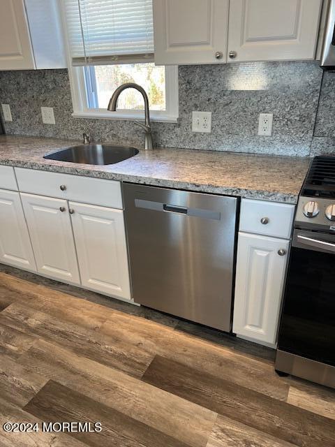718 Pine Drive Brick, NJ 08723 - Photo 9 of 33 a kitchen with granite countertop a sink a stove and cabinets