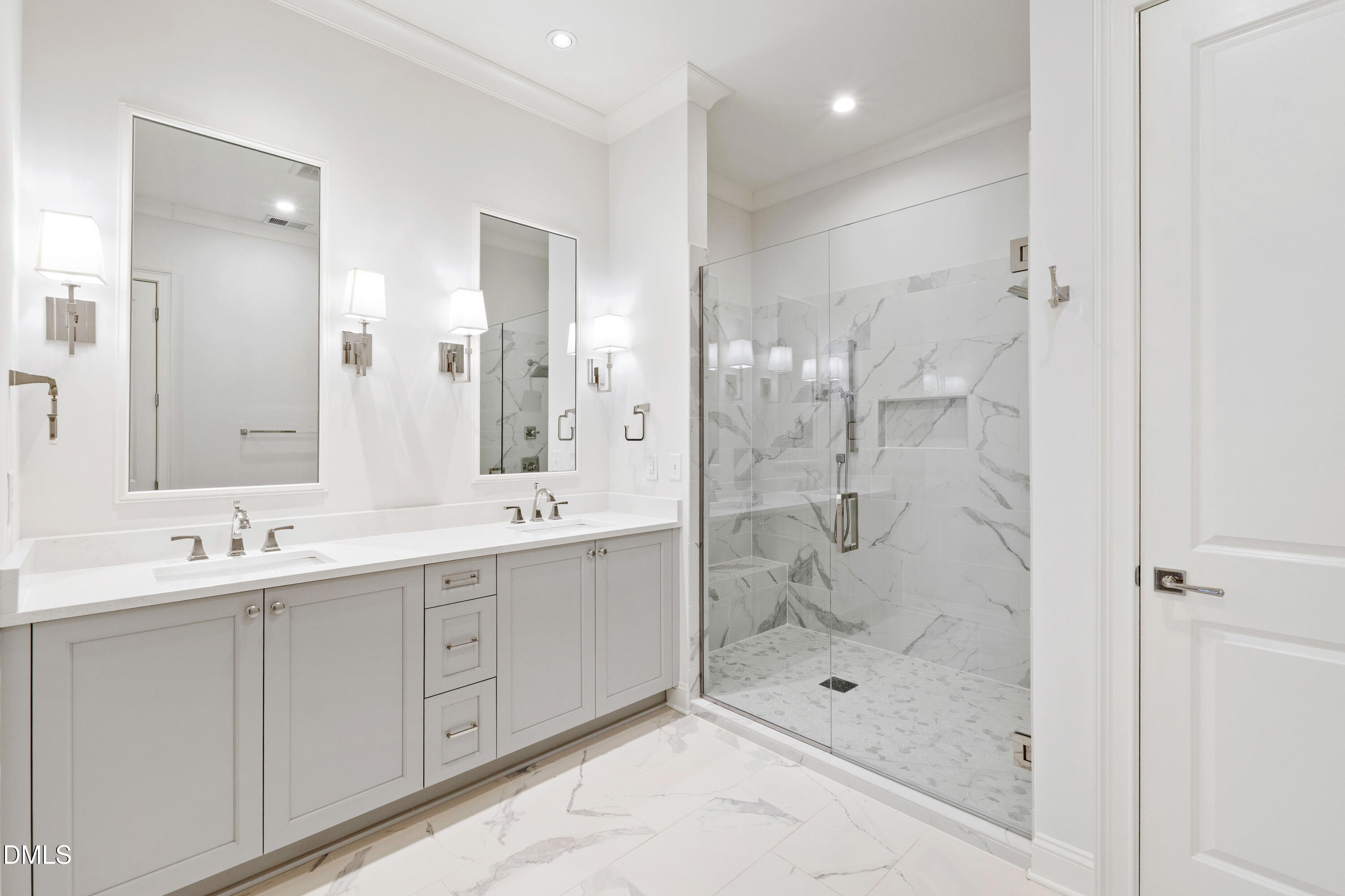 620 Wade Avenue, Unit 103 Raleigh, NC 27605 - Photo 19 of 41 a bathroom with a double vanity sink mirror and shower