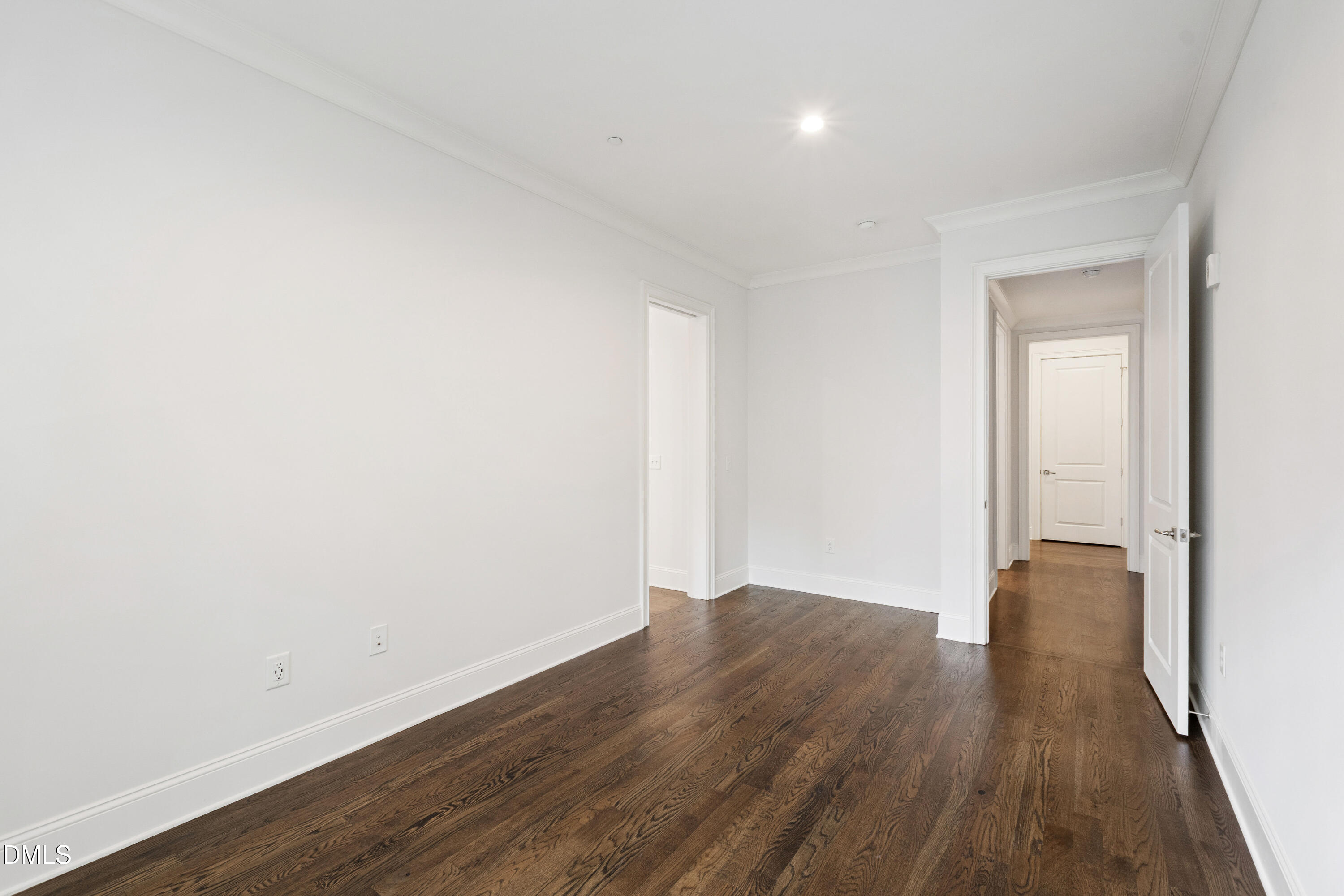 620 Wade Avenue, Unit 103 Raleigh, NC 27605 - Photo 23 of 41 an empty room with wooden floor and closet