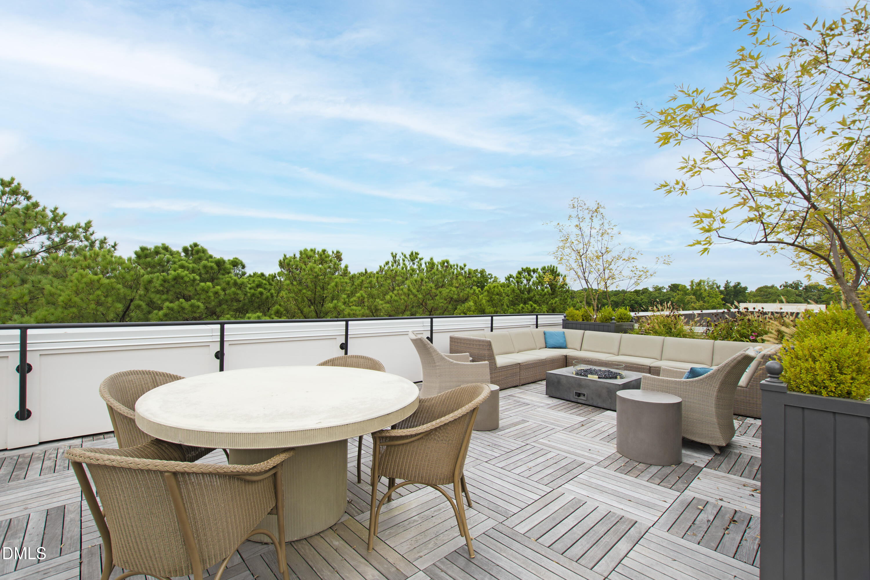 620 Wade Avenue, Unit 103 Raleigh, NC 27605 - Photo 31 of 41 a balcony with table and chairs