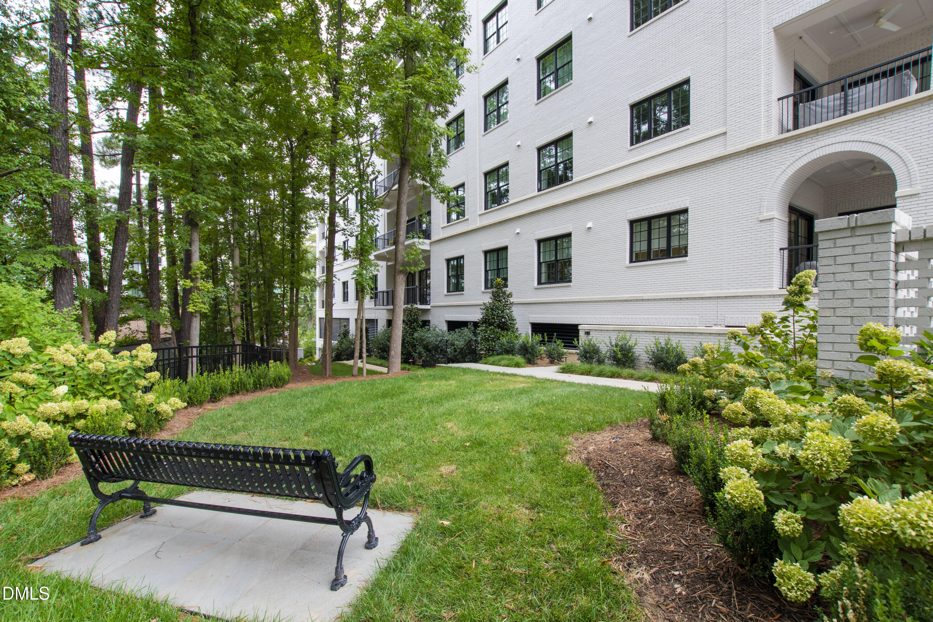 620 Wade Avenue, Unit 103 Raleigh, NC 27605 - Photo 34 of 41 a front view of a house with garden