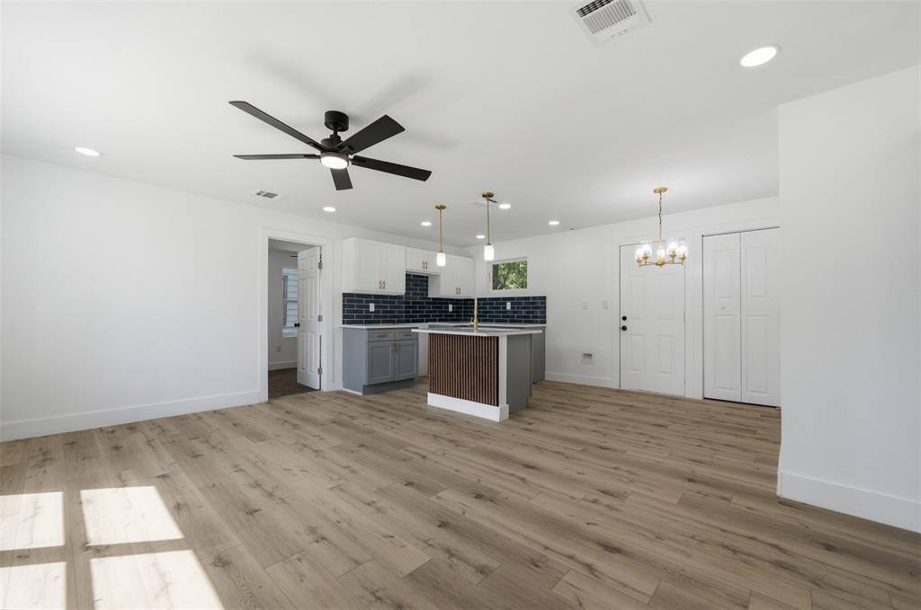 905 East Shaw Street Fort Worth, TX 76110 - Photo 2 of 19 Open-concept room featuring wood-finish flooring, recessed lighting, and a ceiling fan