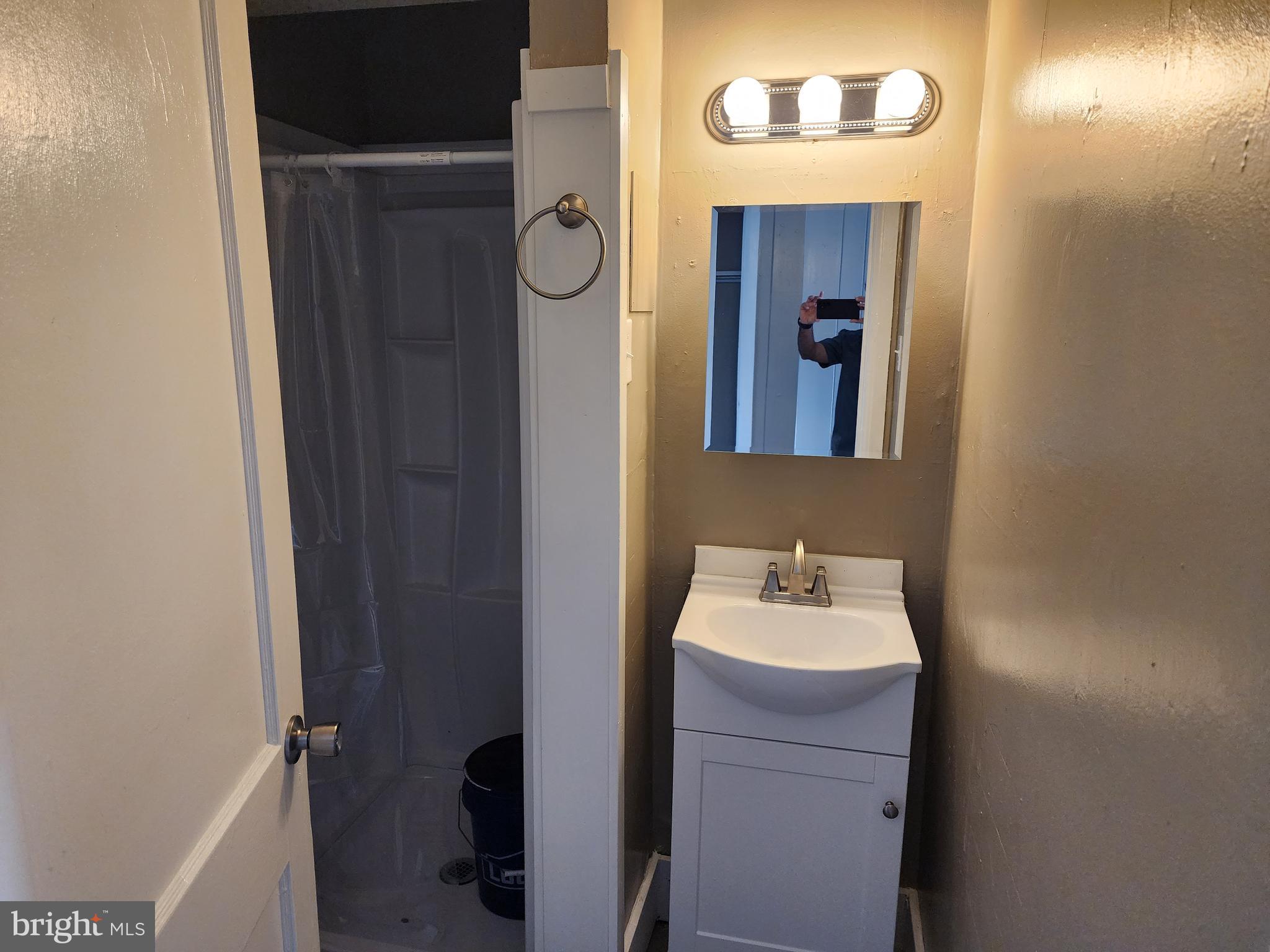 1816 Valley Avenue, Unit 3 Winchester, VA 22601 - Photo 3 of 7 a bathroom with a sink and a mirror