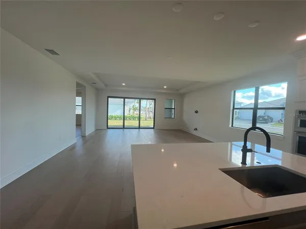 a spacious bathroom with a double vanity sink and a mirror