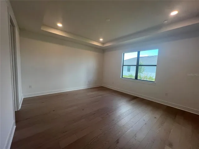 an empty room with closet area