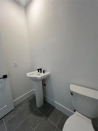 a view of a dining room with furniture and window