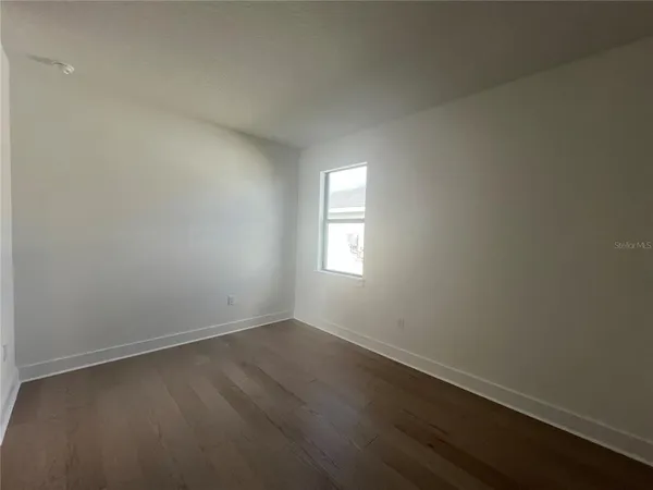 a kitchen with a stove sink and cabinets