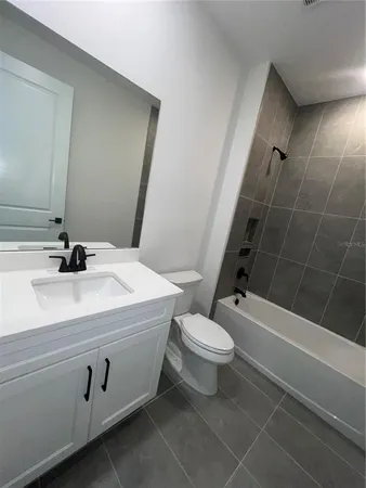 a stove top oven sitting inside of a kitchen