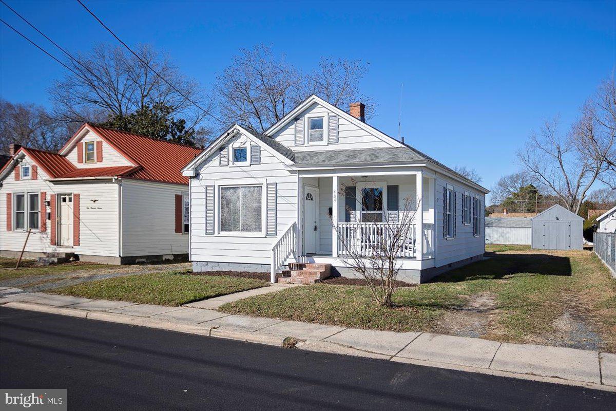 409 Oakley Street Cambridge, MD 21613 - Photo 1 of 12 a front view of a house with a yard