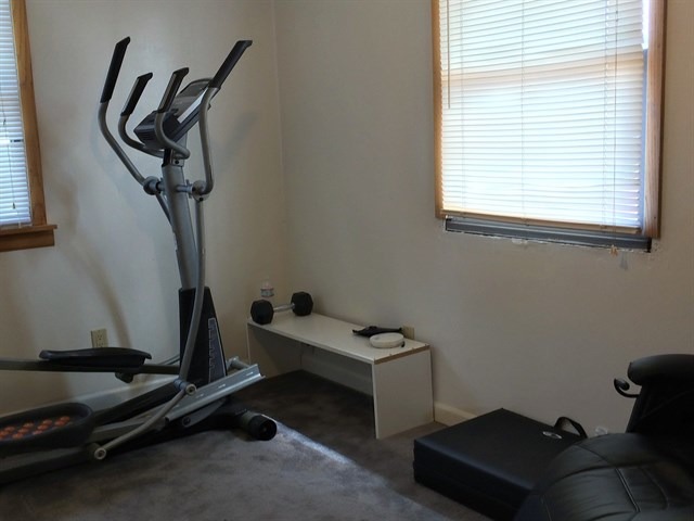 115 East Madison Street Batavia, IL 60510 - Photo 15 of 23 a room with gym equipment and windows
