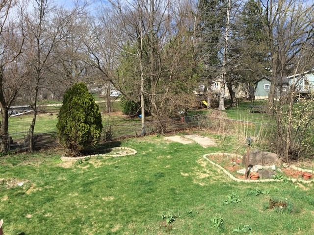 115 East Madison Street Batavia, IL 60510 - Photo 22 of 23 a view of a garden with a bench