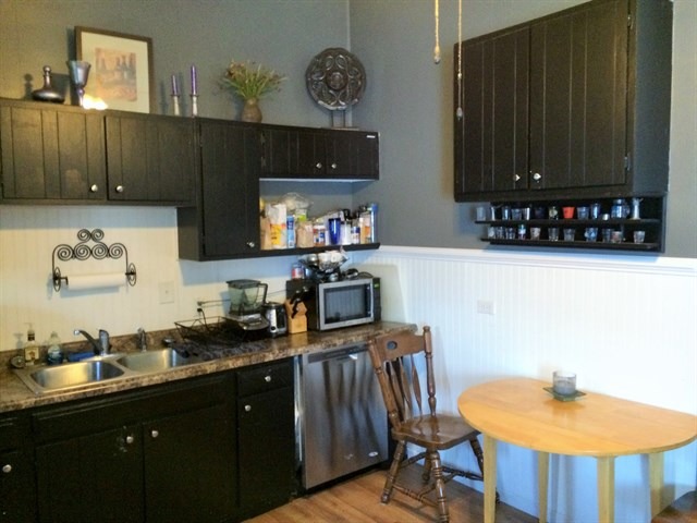 115 East Madison Street Batavia, IL 60510 - Photo 10 of 23 a kitchen with granite countertop a sink cabinets and stainless steel appliances