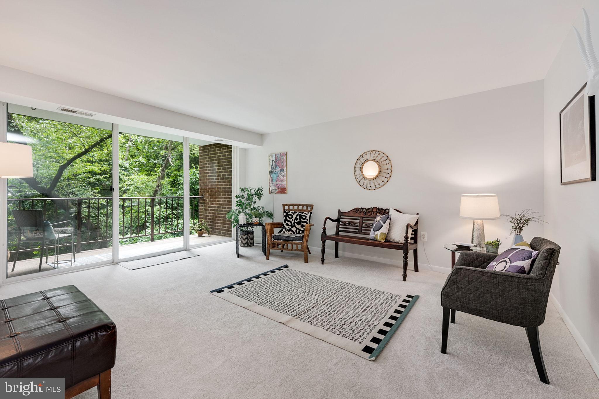 1411 Northgate Square, Unit 141112B Reston, VA 20190 - Photo 2 of 31 Walk to the patio through a newer sliding door