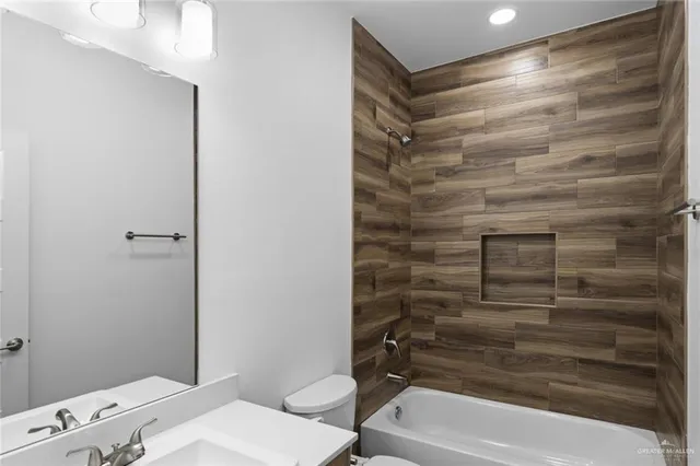 a bathroom with a bathtub and a sink