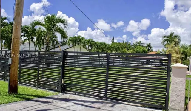 a view of a street with a building in the background