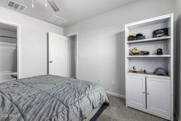 a bedroom with a bed and closet