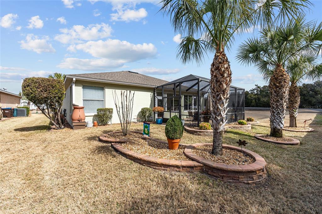 16339 Southwest 14th Avenue Road Ocala, FL 34473 - Photo 22 of 22 a view of a house with backyard and swimming pool