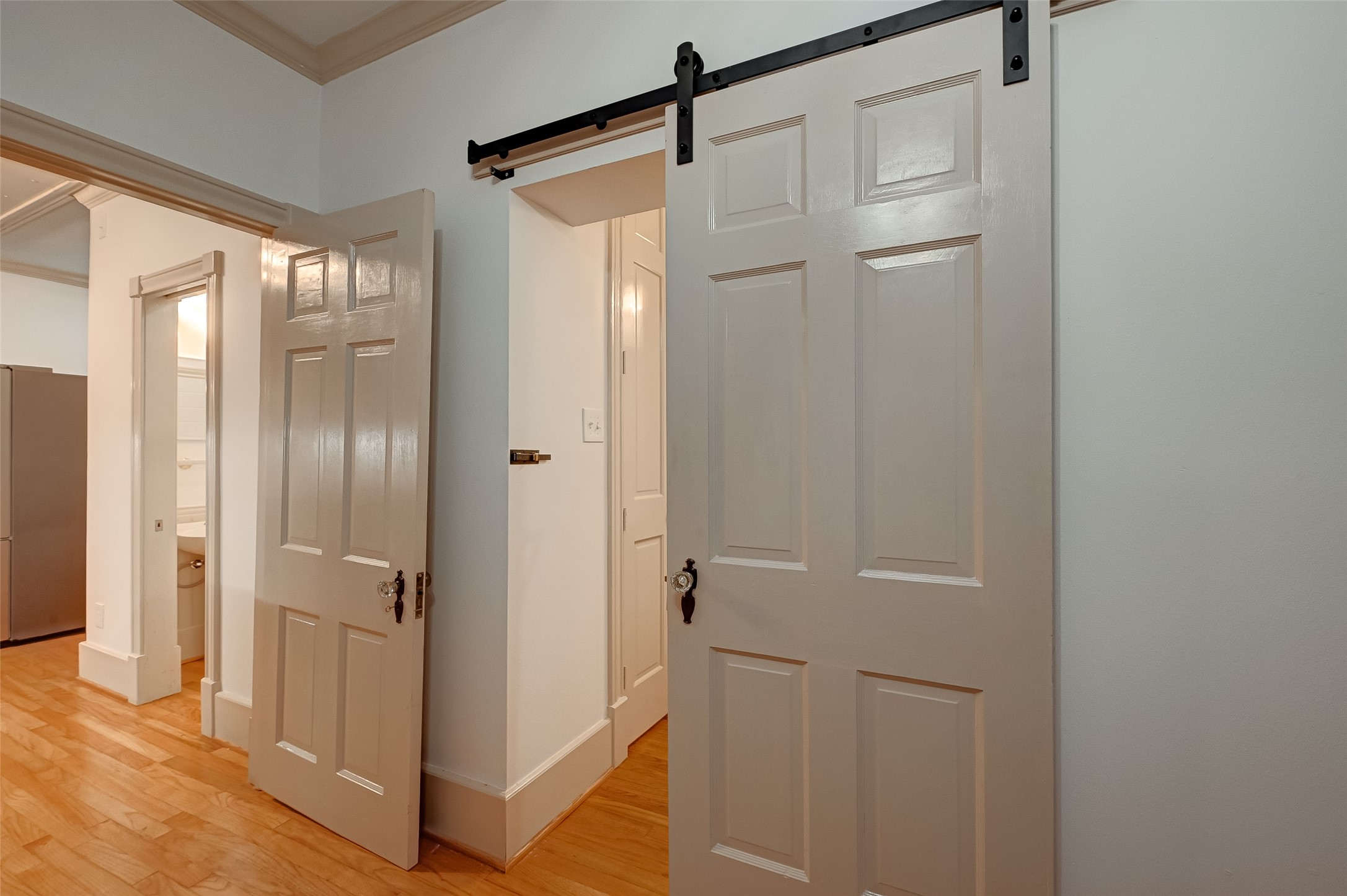 2009 State Street Houston, TX 77007 - Photo 16 of 42 The hanging hinged restored vintage pine wood door provides privacy for the Primary Bath