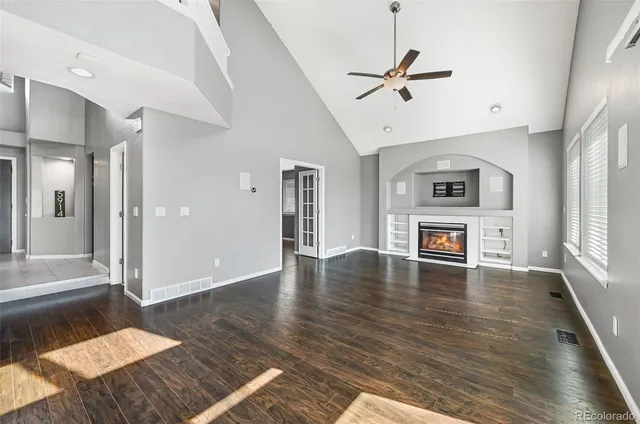 a view of livingroom with hardwood floor and a ceiling fan