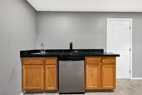 a view of an empty room and a window