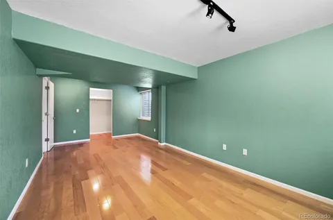 a bedroom with bed and a couch