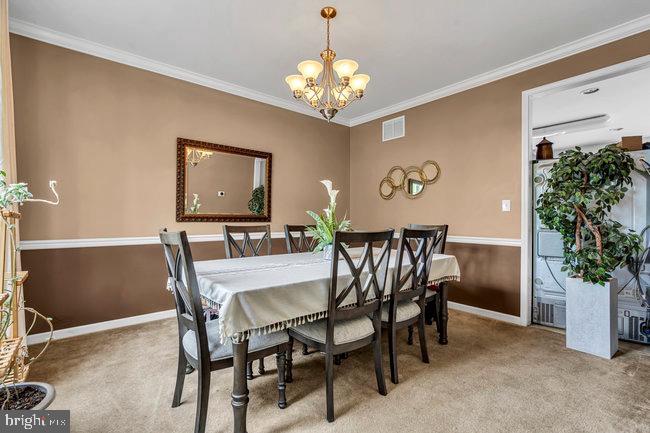 30 Homestead Drive Pemberton, NJ 08068 - Photo 11 of 51 a view of a dining room with furniture and chandelier