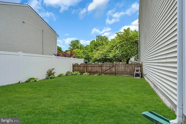 a view of backyard with green space