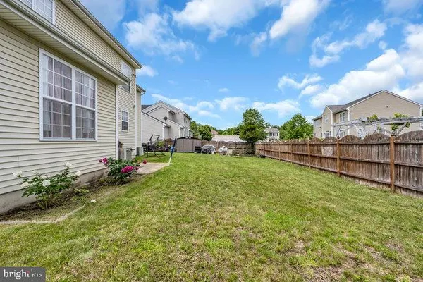 a view of a backyard with sitting area