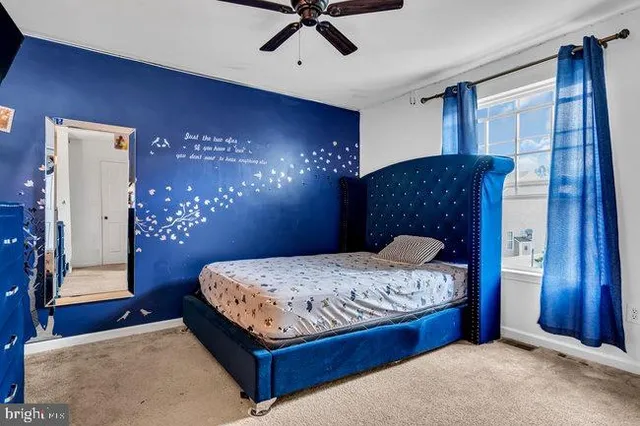 a bedroom with a bed and a table