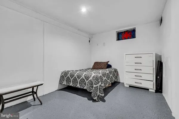 a bedroom with a bed and cabinets