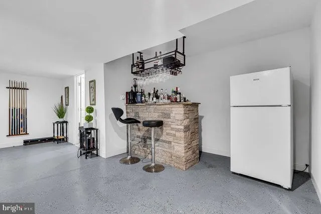 a view of kitchen and refrigerator