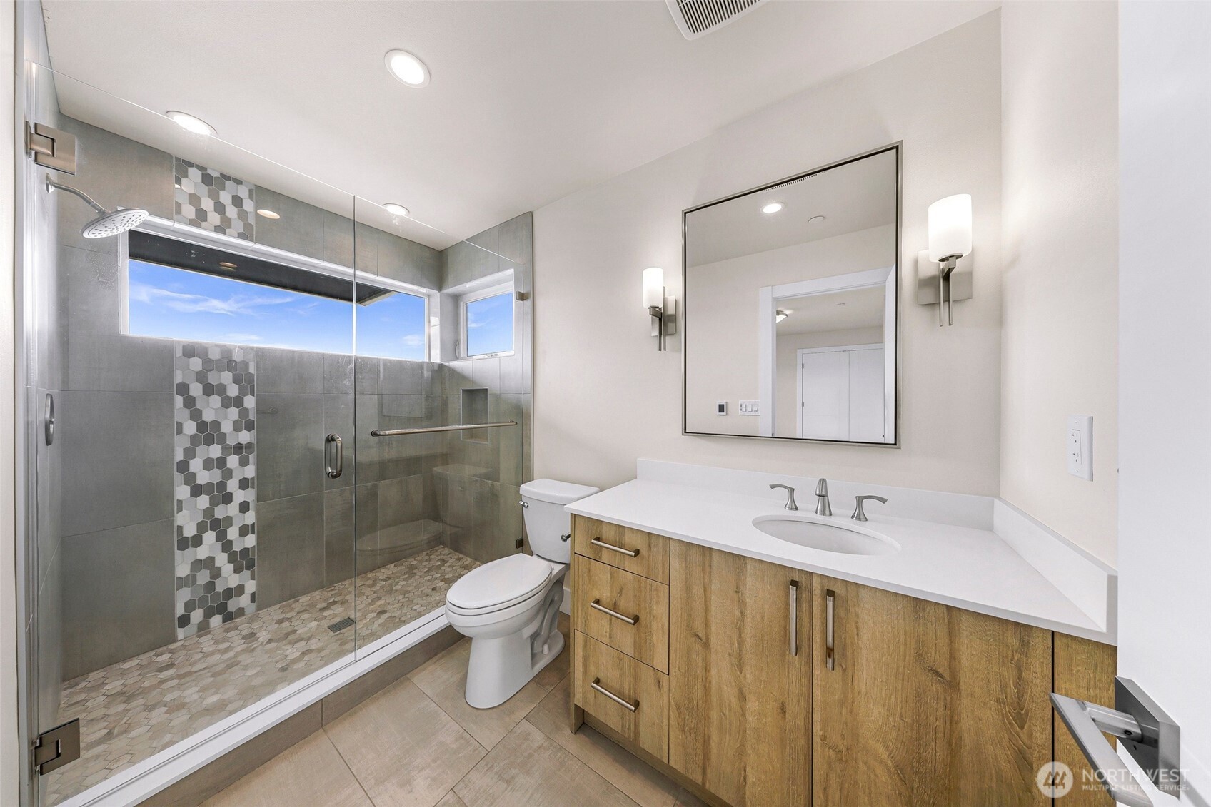 12065 30th Avenue Southwest Burien, WA 98146 - Photo 25 of 40 a bathroom with a sink a toilet and shower