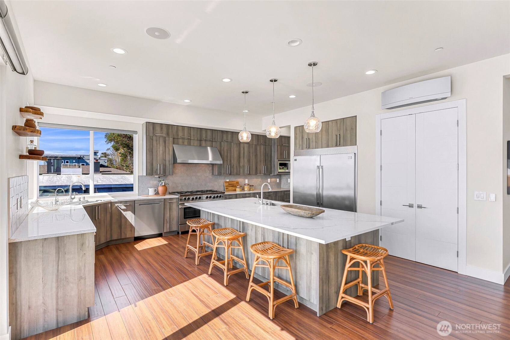 12065 30th Avenue Southwest Burien, WA 98146 - Photo 10 of 40 a large kitchen with a table and chairs in it