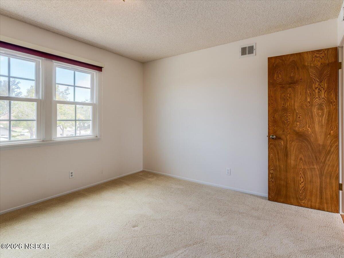 360 Tallyho Road Santa Maria, CA 93455 - Photo 37 of 72 an empty room with windows