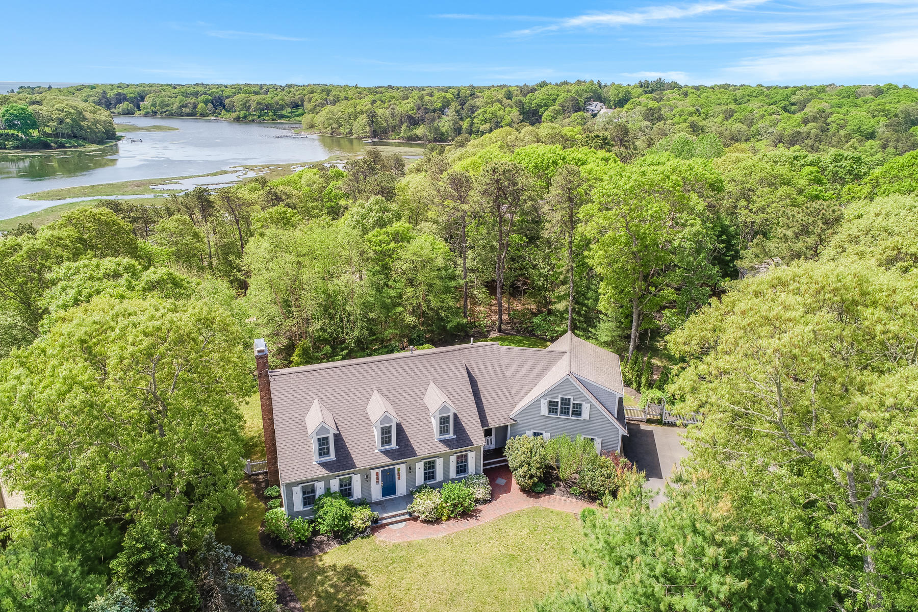 an aerial view of residential house with outdoor space and lake view