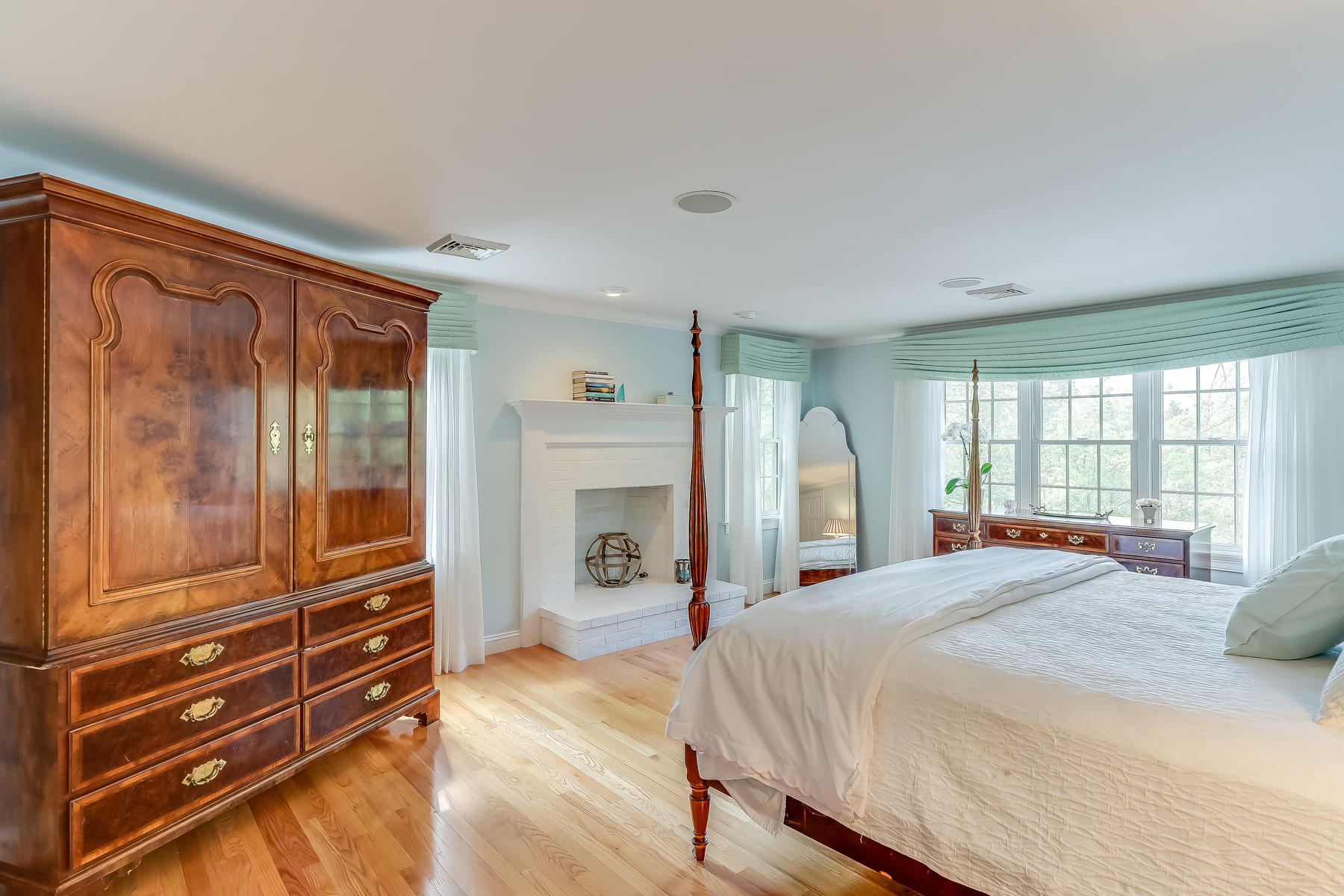 117 Wild Goose Way Centerville, MA 02632 - Photo 25 of 51 a bedroom with a bed and wooden floor