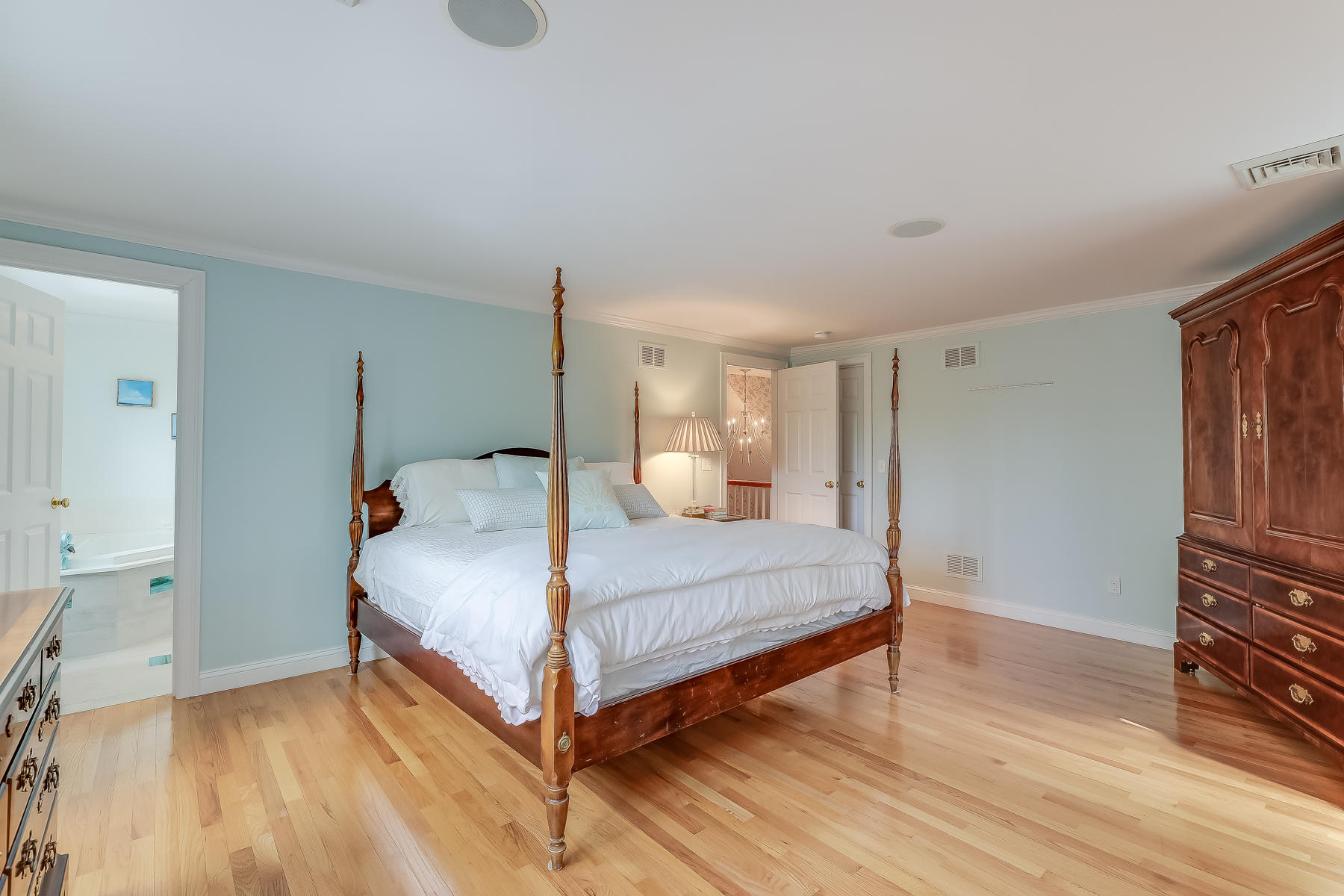 117 Wild Goose Way Centerville, MA 02632 - Photo 26 of 51 a bedroom with a bed and wooden floor