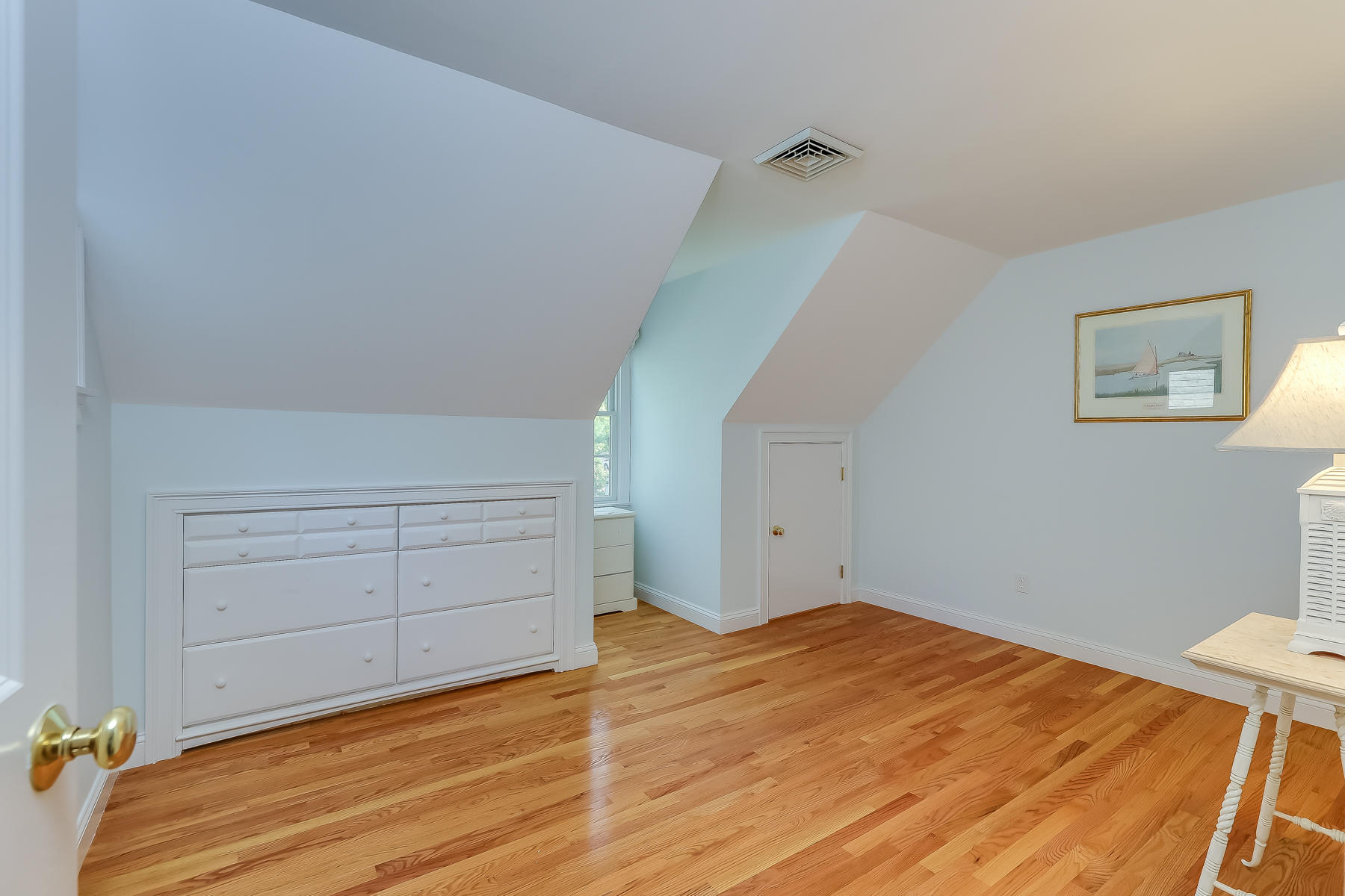 117 Wild Goose Way Centerville, MA 02632 - Photo 30 of 51 a bedroom with a bed and cabinets