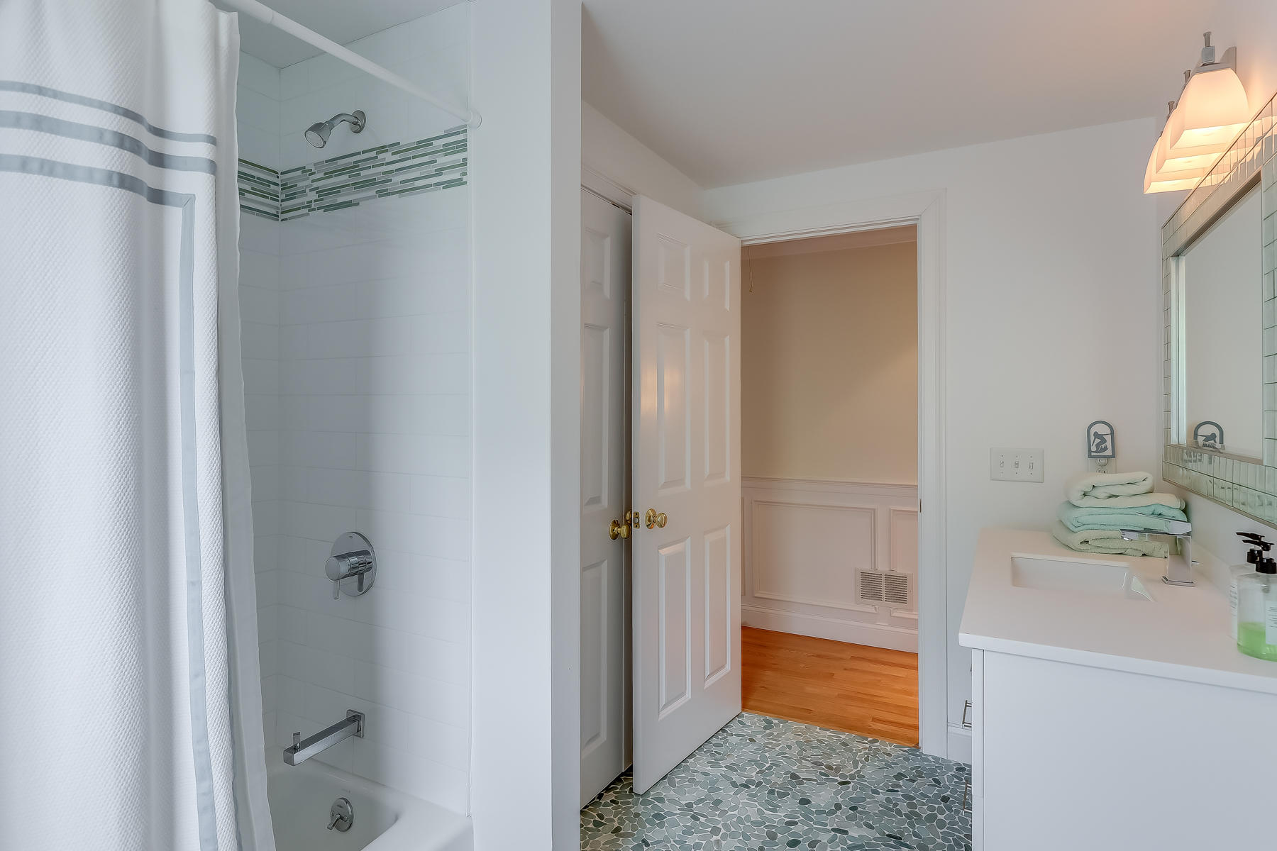 117 Wild Goose Way Centerville, MA 02632 - Photo 32 of 51 a bathroom with a tub shower vanity and a sink