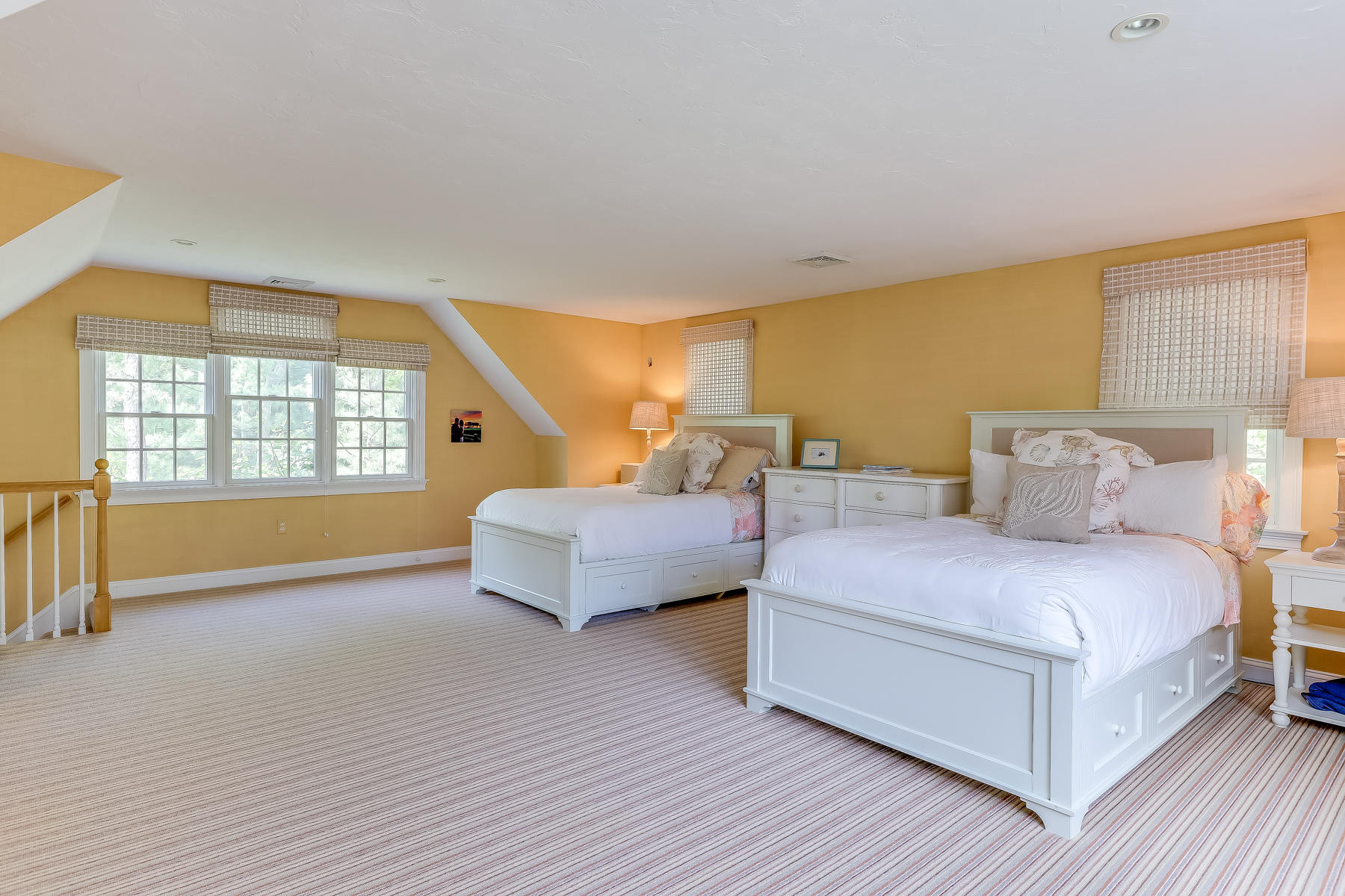117 Wild Goose Way Centerville, MA 02632 - Photo 35 of 51 a spacious bedroom with a bed and wooden floor