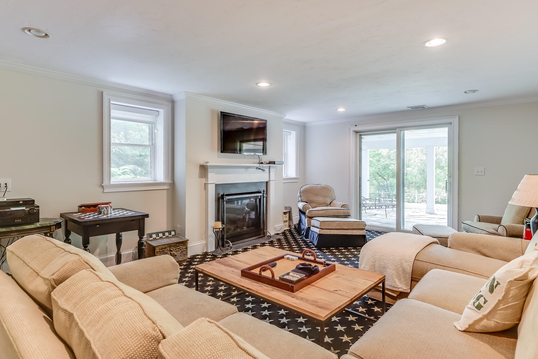 117 Wild Goose Way Centerville, MA 02632 - Photo 37 of 51 a living room with furniture a fireplace and a flat screen tv