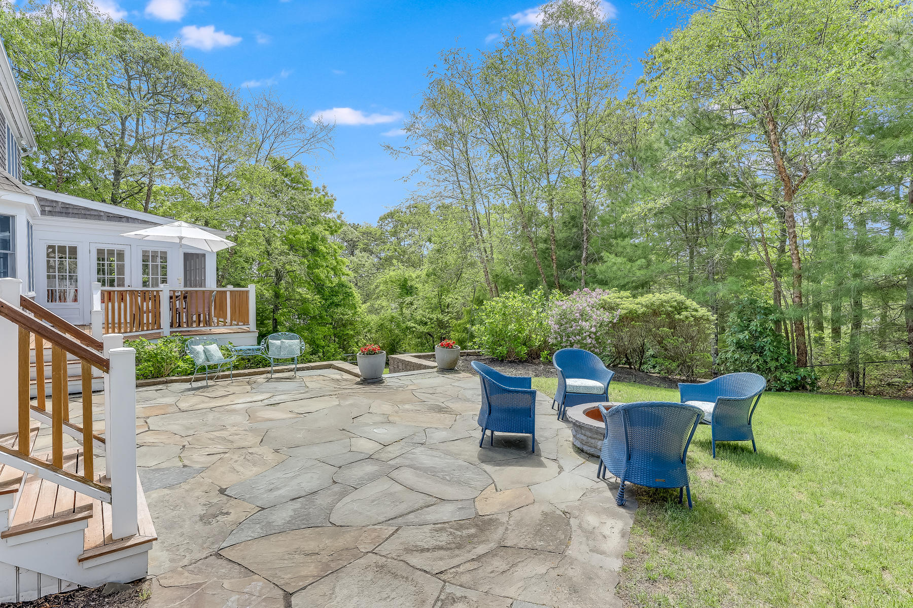 117 Wild Goose Way Centerville, MA 02632 - Photo 40 of 51 a view of a patio with table and chairs and potted plants