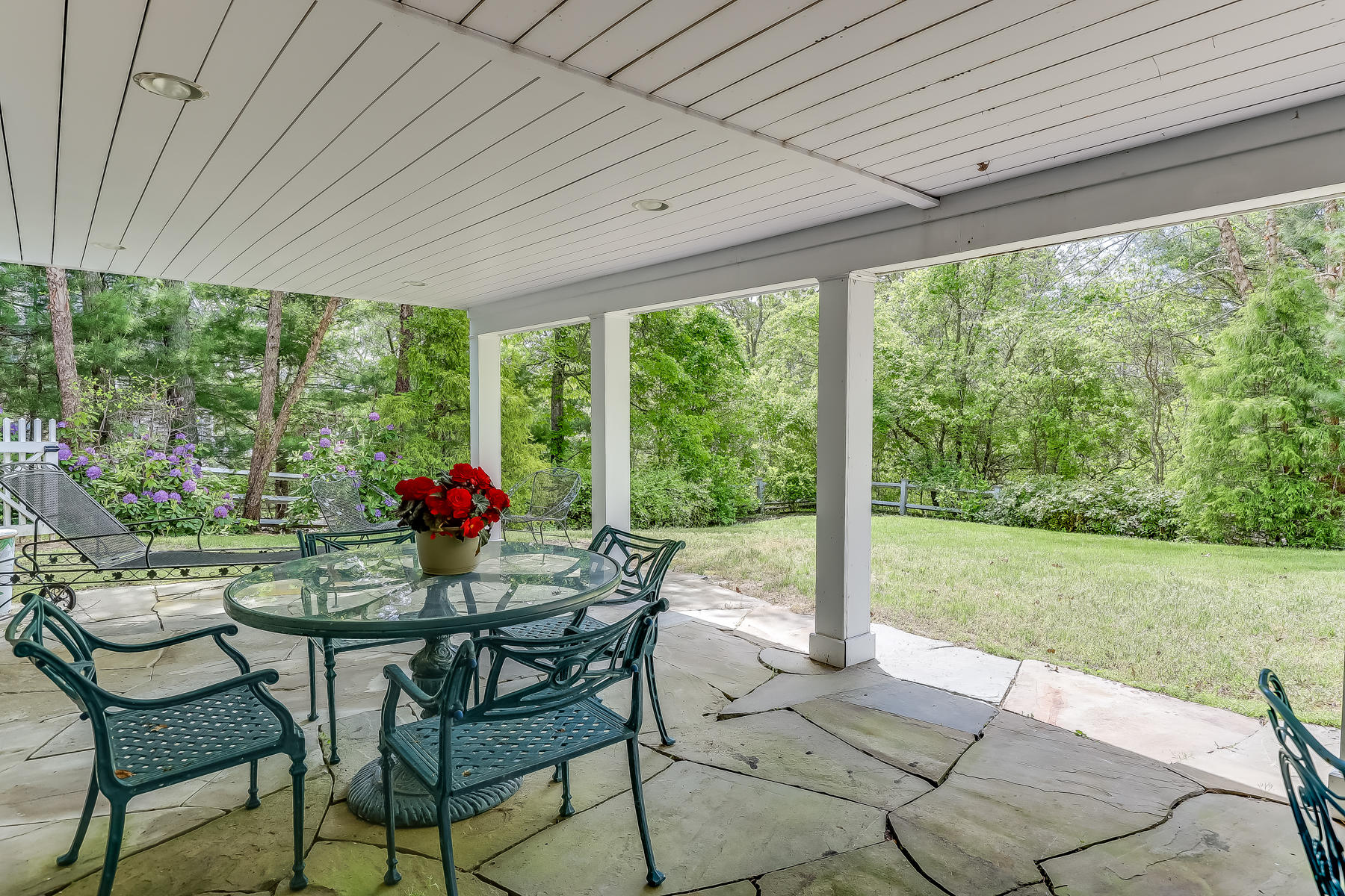 117 Wild Goose Way Centerville, MA 02632 - Photo 43 of 51 a view of an outdoor dining space with a table chairs and backyard