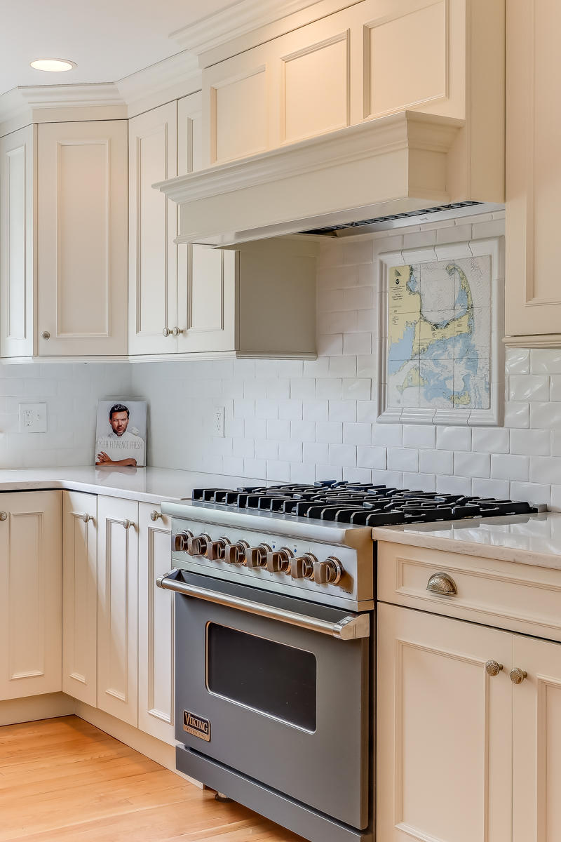 117 Wild Goose Way Centerville, MA 02632 - Photo 6 of 51 a white stove top oven sitting inside of a kitchen