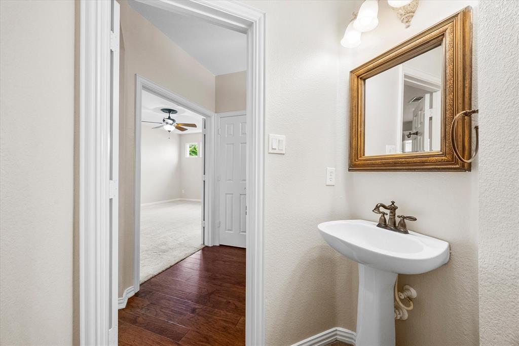 645 Channel Ridge Drive Rockwall, TX 75087 - Photo 22 of 40 There's even a convenient powder bath for your guests.
